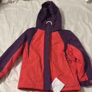 Hot pink and purple ski jacket. Fleece lined. Snow skirt inside jacket. 7/8